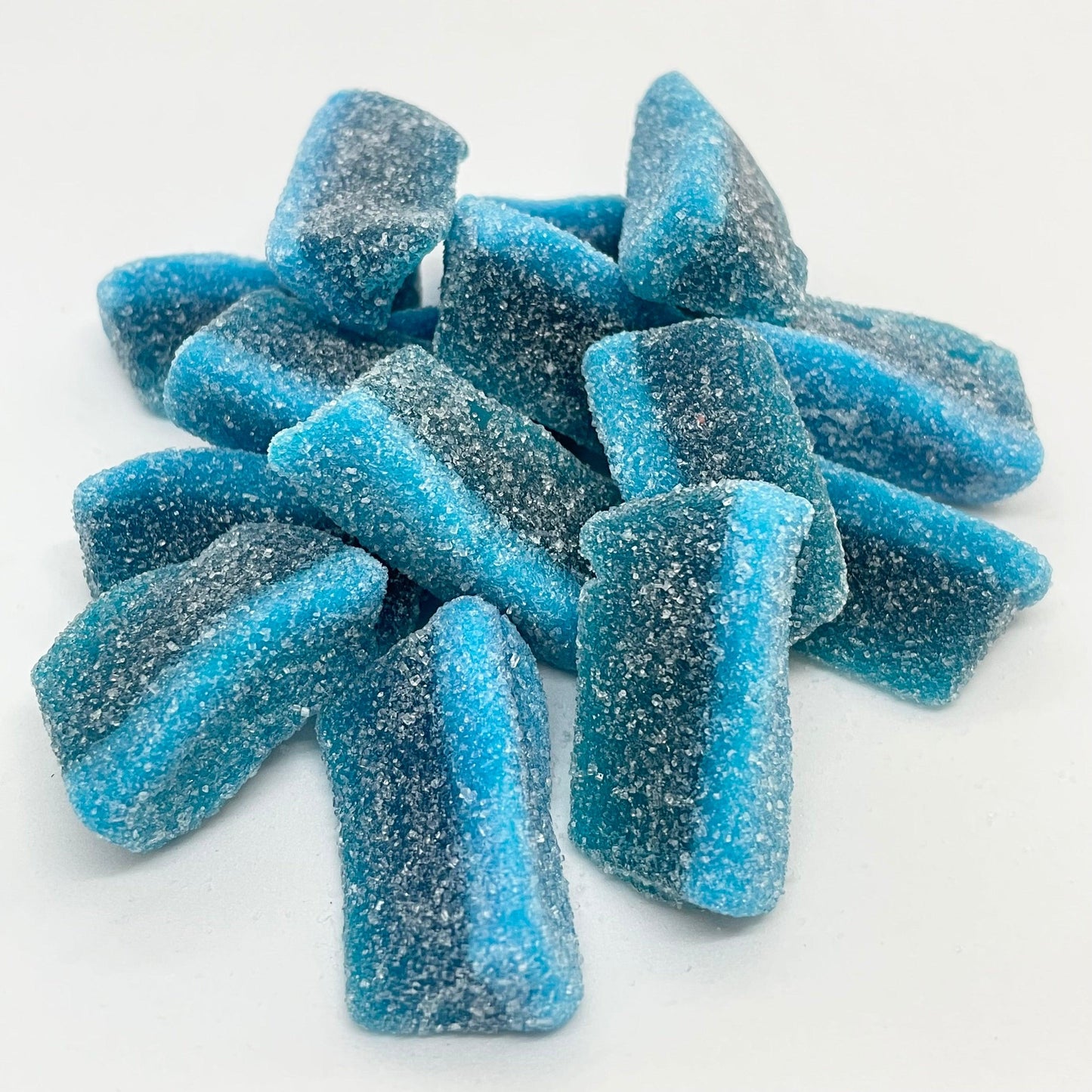 Experience the mouth-watering taste of Blue Raspberry Slices. These sugar-coated jelly sweets are bursting with delicious blue raspberry flavour. Treat your taste buds to a sweet and fruity sensation with every bite. Perfect for satisfying your sweet cravings.