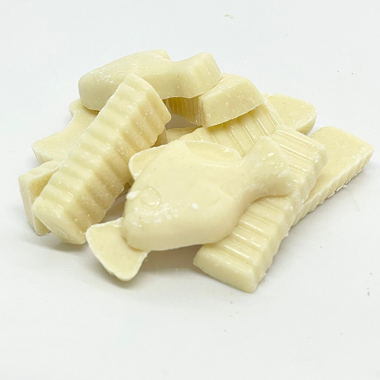 Fish & Chips are a delectable treat for any chocolate lover. These delicious white chocolate pieces are shaped like fish and crinkle cut chips, making them a unique and fun snack. shops now at That Sweet Place