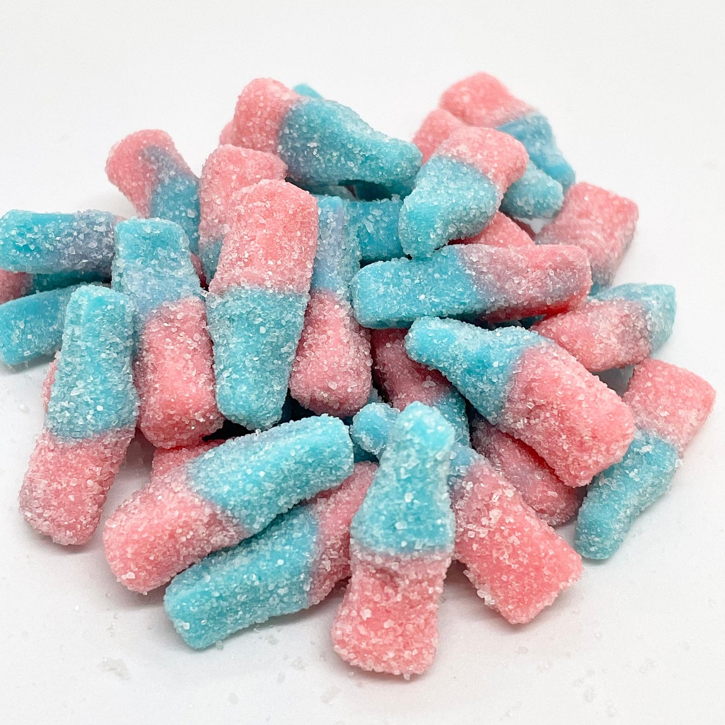 Our fizzy, blue and pink bubblegum bottles are a hit with all ages. These tasty sweets are perfect for satisfying your sweet tooth and bringing a nostalgic touch to any occasion. 
