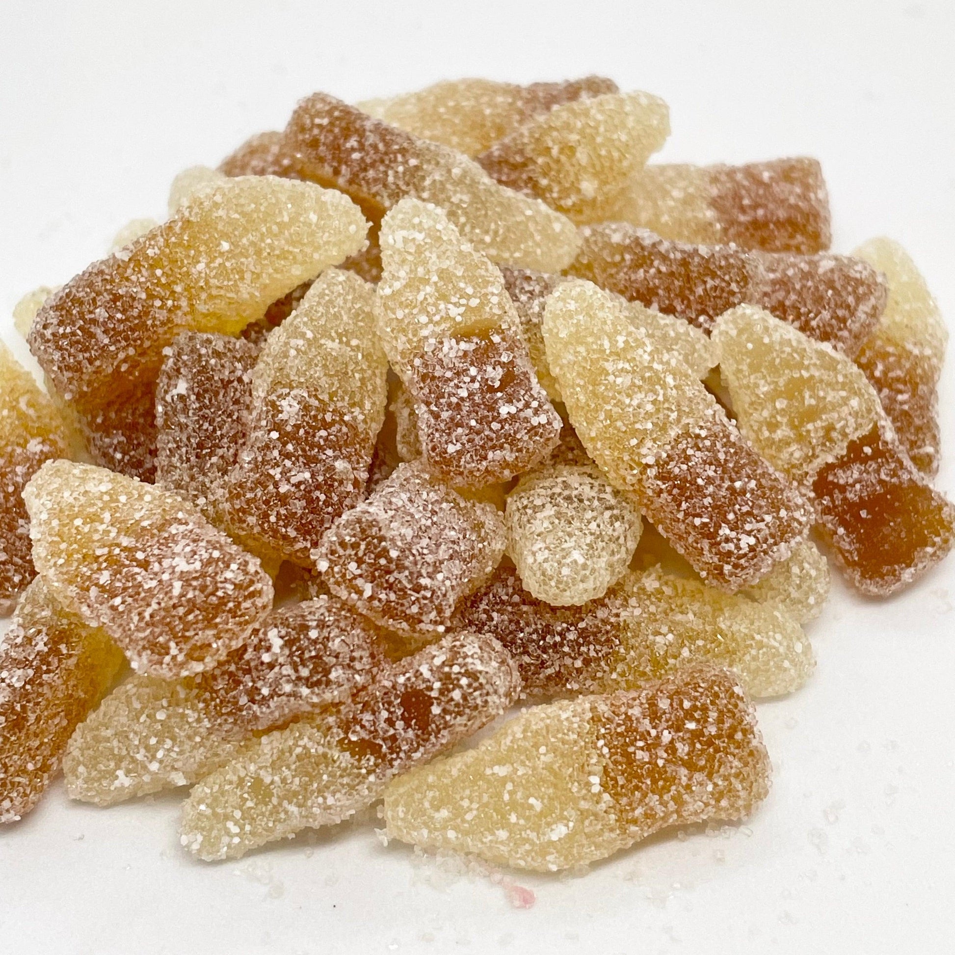 Experience a burst of flavour with these Fizzy Cola Bottles! Each bite will tantalize your taste buds with cola flavoured jelly, perfectly coated in a tangy sourness. Satisfy your cravings with this delicious treat that will leave you wanting more!