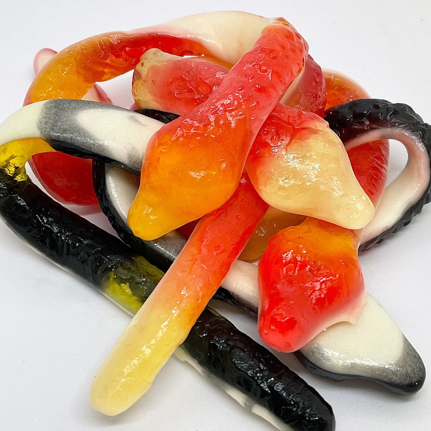 Experience the delicious combination of fruit and cola in our Giant Snakes. These 23cm long jelly snakes feature a soft foam bottom for an extra burst of flavor. Perfect for satisfying your sweet tooth without compromising on taste. Shop Now
