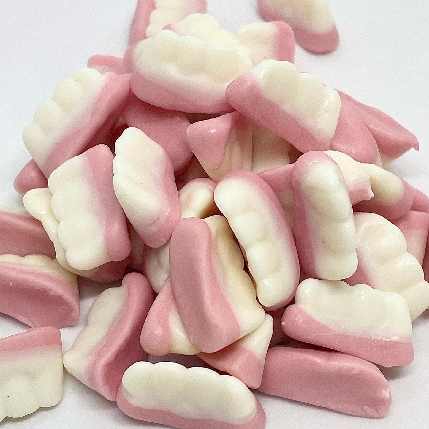 Experience a burst of sweet strawberry flavour with every bite of our Gummy Teeth sweets. These delicious treats are guaranteed to satisfy your sweet tooth. Perfect for any occasion, these gummies are sure to be a hit with both kids and adults alike. Shop Now