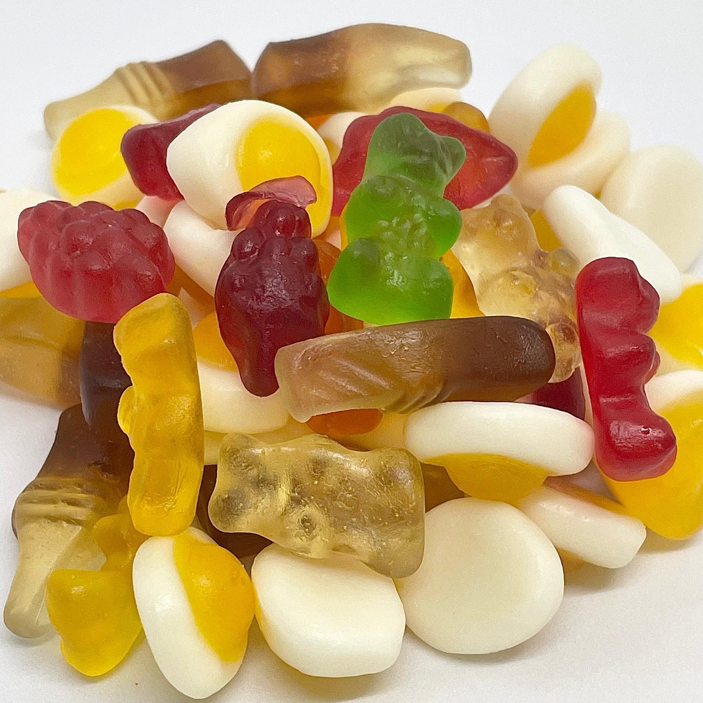Party Mix is the perfect treat for any occasion. Our assortment of jelly sweets includes delicious options like cola bottles, happy bears, fried eggs, fruity heart, and juicy berries. With an irresistible combination of flavours, each bite will be a party for your taste buds. available now at That Sweet Shop