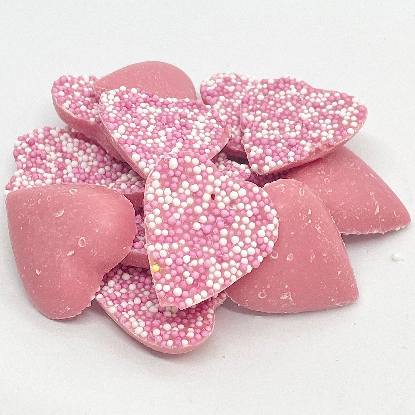  These delicious chocolate pieces are infused with a delectable strawberry flavour and topped with pink hundreds and thousands, making them a delightful treat for the senses. 