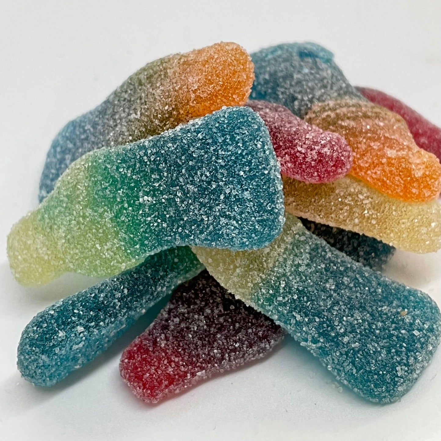 Enjoy the tangy and sweet taste of Fizzy Tutti Frutti bottles. Packed with juicy flavour and coated in fizzy sugar, these bottles are a true delight. Satisfy your cravings with this fun and flavourful treat.