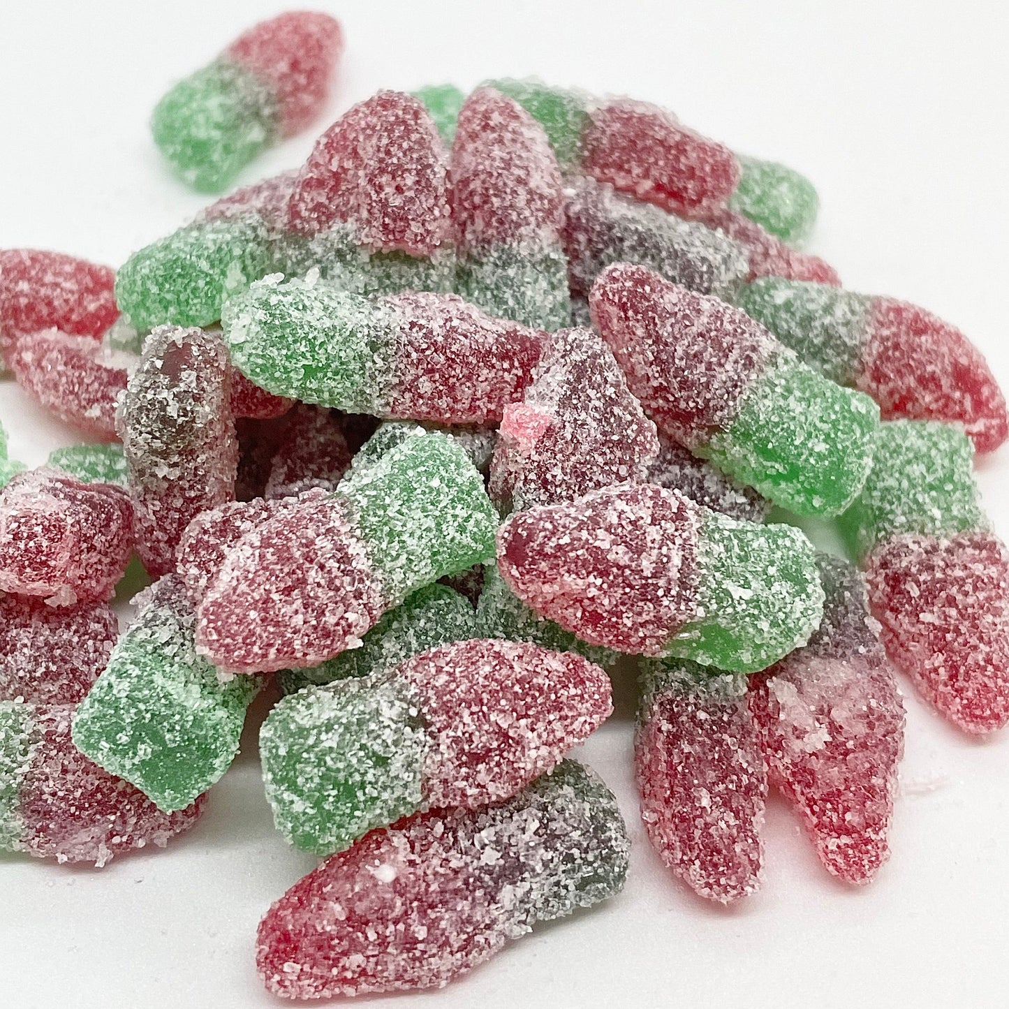 Indulge in the refreshing taste of Watermelon Bottles - delicious watermelon flavoured jelly sweets with a fizzy kick. These treats are perfect for satisfying your sweet cravings while providing a burst of juicy flavour. Try them today for a tasty and tangy experience. Available at That Sweet Place
